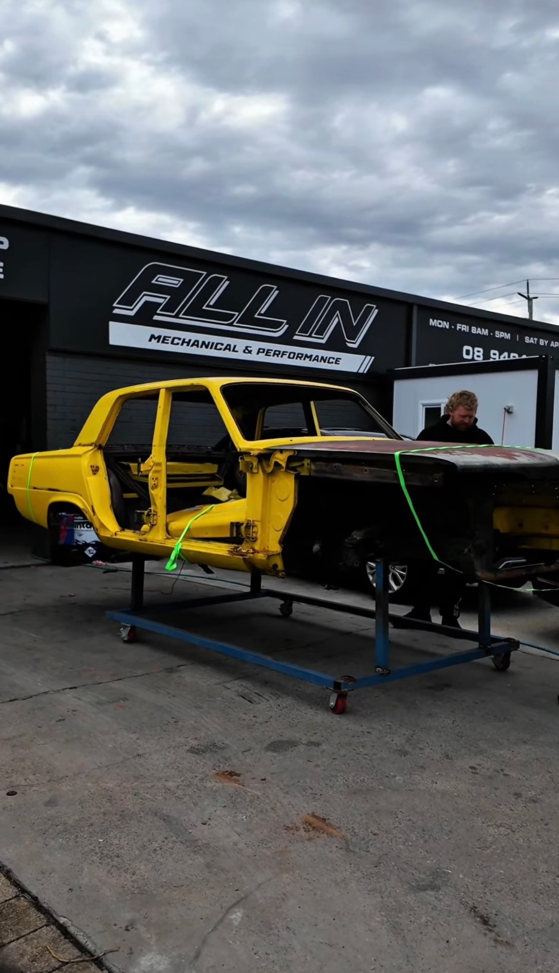 Classic car restoration project outside the workshop