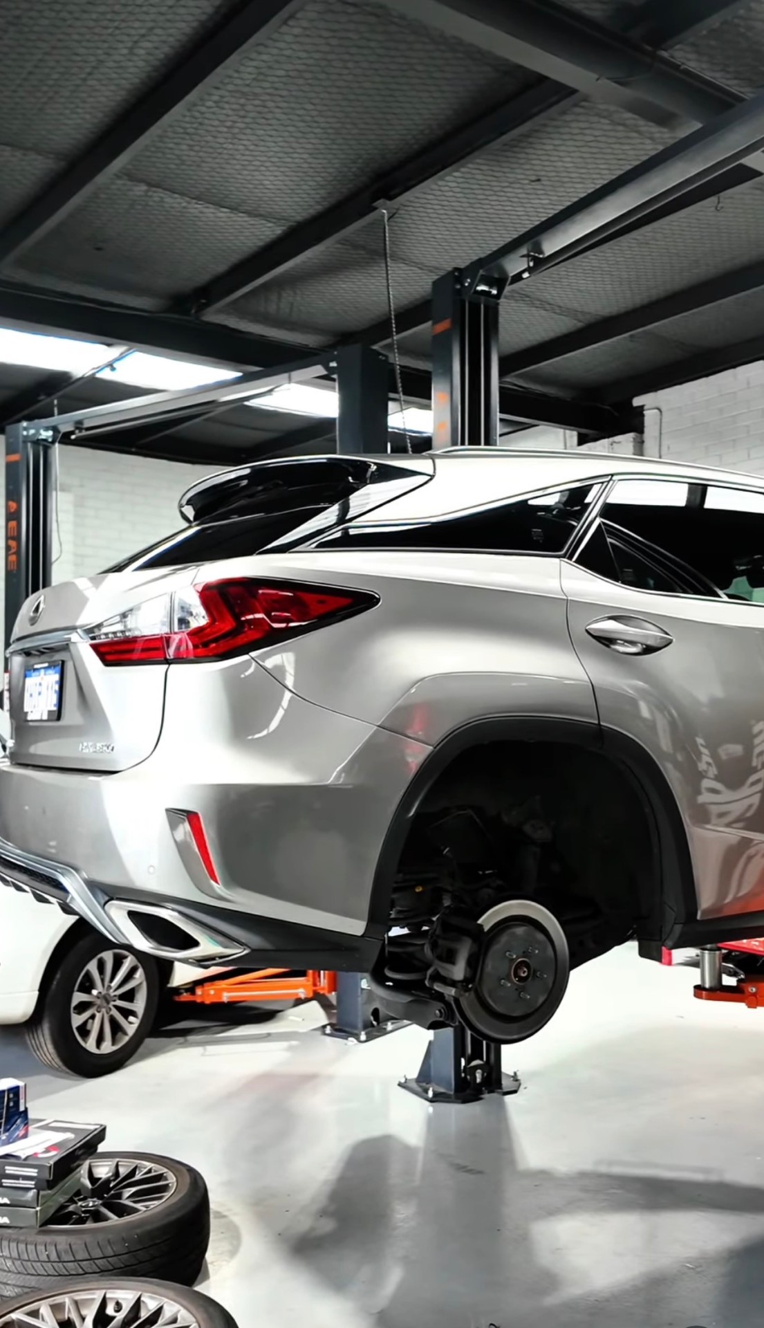 Lexus SUV up on the hoist for servicing